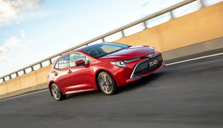2019 Toyota Corolla ZR hybrid red front 3/4 driving