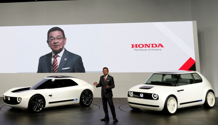 Honda Motor Chief Executive Officer Takahiro Hachigo presents concept cars NeuV, Honda Sports EV Concept and Urban EV Concept during media preview of the 45th Tokyo Motor Show in Tokyo